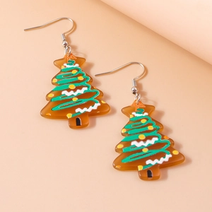 Detail of Christmas tree earrings with green spiral patterns and silver metal hooks