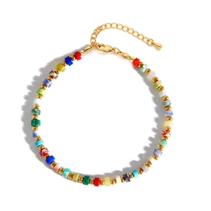 Handmade bohemian style bracelet with colorful natural stones and golden spacer beads