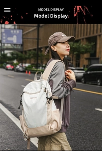 Outdoor street view of a high-capacity cream and khaki backpack on a model in urban style