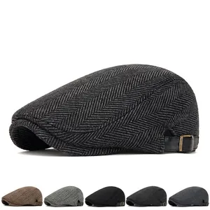 Classic dark grey herringbone beret cap with adjustable side leather strap and brass buckle