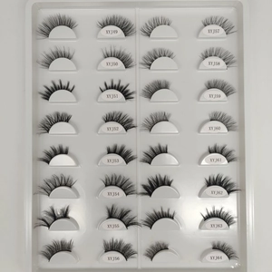 Flat lay of 16 pairs of cat-eye false eyelashes with various styles and model codes