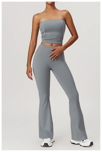 Detail view of high-waist yoga set with contrast stitching and flare legging design