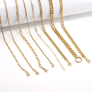 Set of 8 assorted golden stainless steel cuban and link chains on white background