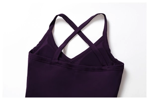 Detail of purple tennis dress with crisscross back straps and built-in bra pads