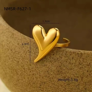 Macro shot of gold heart ring with dimensions 2.3cm x 1.7cm and adjustable band detail