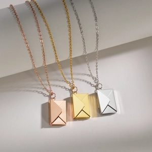 Stainless steel envelope locket necklaces in gold, rose gold, and silver finishes