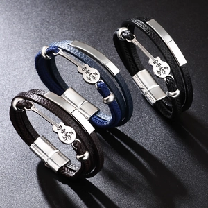 Three multi-layer leather bracelets with guitar charms in black, blue, and brown tones