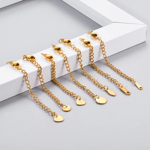 Golden stainless steel extension chains with lobster clasps and diverse charm tags