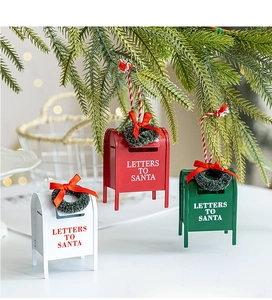 Close-up of three decorative metal mailboxes with Letters to Santa text and wreaths