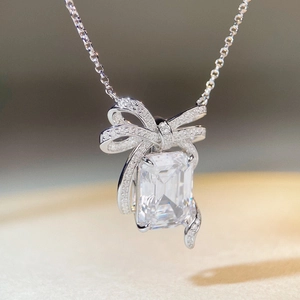 Elegant S925 sterling silver bow necklace featuring a large emerald-cut zircon pendant