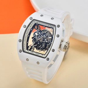 Detail of white tonneau-shaped skeleton watch showing internal mechanical gear movement