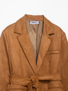 Close-up of brown faux suede jacket collar and pockets with minimalist belt detail