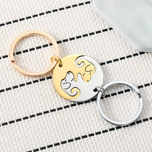 Matching dog couple keychains in gold and silver finish for pet lovers and backpacks