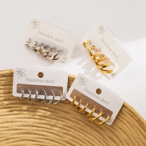 Minimalist stainless steel hoop earring set in gold and silver on display cards