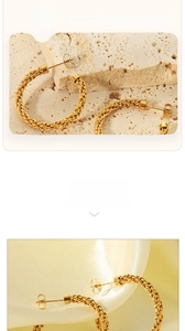 Detailed view of 18K gold plated C-shaped hoop earrings with woven mesh texture detail