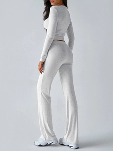 Side view of grey Y2K two-piece set featuring slim-fit long sleeve top and flared pants