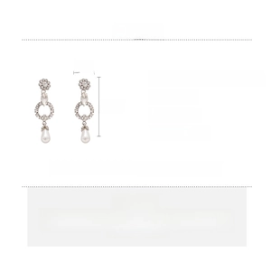 Detail showing elegant flower rhinestone earrings with a white teardrop imitation pearl drop