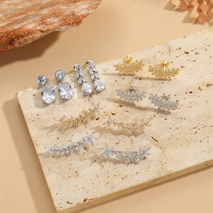 Elegant leaf and flower ear climbers set with cubic zirconia stones in gold and silver