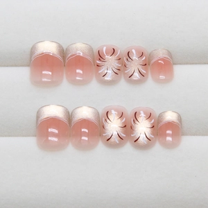 Faux ongles œil-de-chat roses avec pointes dorées pailletées et motifs feu d'artifice