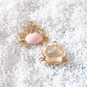 Pink enamel crab charms with gold plating shown in front and back view for DIY jewelry