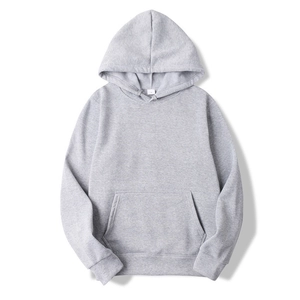 Detailed close-up of a grey pullover hoodie featuring a front kangaroo pocket and ribbed cuffs