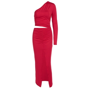 Red one-shoulder long sleeve crop top and high waist ruched maxi skirt with side slit
