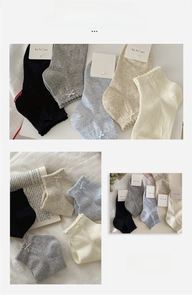 Detail of five-color women cotton ankle socks with bow lace trim and mesh hollow patterns
