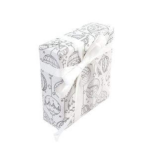Vintage Christmas kraft paper gift box with black hand-drawn festive patterns and white ribbon