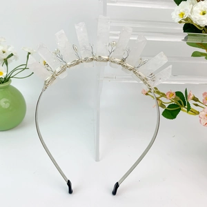 Detail of handmade silver crown headband with raw crystals, floral wire and white pearls