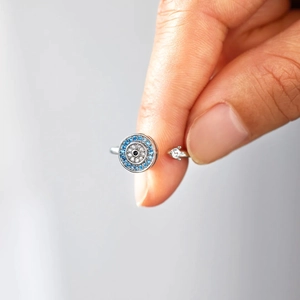 Detailed view of adjustable S925 silver evil eye ring with blue and white zircons