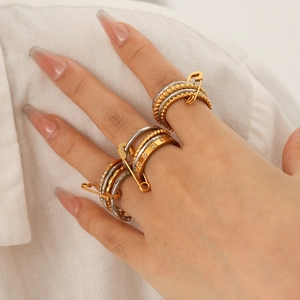 Layered gold and silver stainless steel rings with paperclip design and pavé crystals