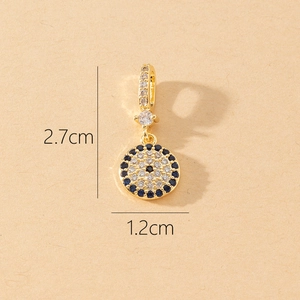 Macro detail of Evil Eye pendant in gold with blue stones showing 2.7cm height size