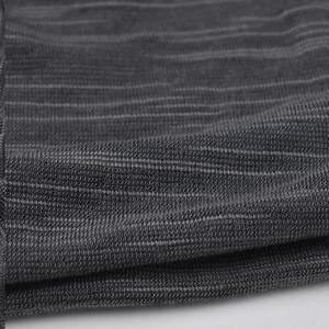 Close-up of charcoal grey knitted cotton fabric showing fine mesh texture and horizontal lines