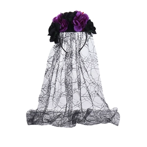 Detail of Halloween spider web lace veil with purple and black artificial roses
