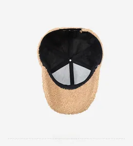 Detailed interior view of thick sherpa baseball cap showing black fabric lining and seams