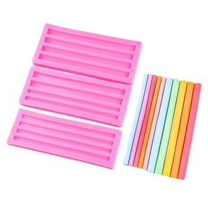 Pink silicone mold set with 12 slots for making long semicircular candle wax sticks