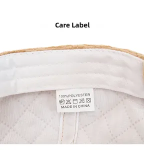 Macro view of inner lining with high-quality stitching and care label on corduroy cap