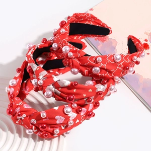 Three-piece red knotted headband set with faux pearls and heart patterns for women