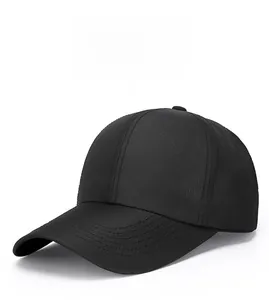 Detail view of the black baseball cap showing classic side embroidery and mesh texture