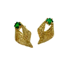 Golden irregular earrings with emerald zircon and hammered texture on white background