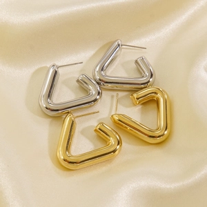 Minimalist triangle titanium steel hoop earrings in gold and silver finish on silk