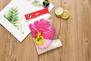 Pink exfoliating bath glove in clear retail packaging with body scrubber branding