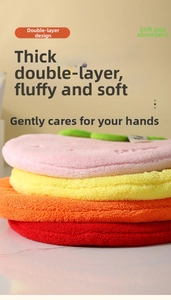 Detail showing the thick double-layered coral velvet texture of these fruit-themed towels