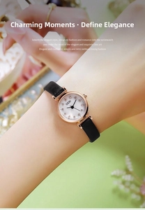 Elegant rose gold watch on wrist featuring a black leather strap and white dial detail