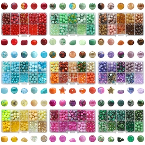 Macro view of multi-color DIY jewelry bead set in a 10-grid clear storage organizer box