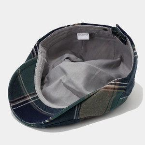 Classic plaid flat cap in dark green and navy blue cotton with adjustable metal buckle
