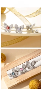 Detailed view of butterfly stud earrings with zircon inlay and screw back closure