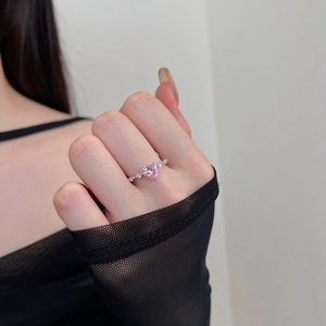 Detailed view of the pink heart zirconia stone on the S925 silver ring worn on a hand