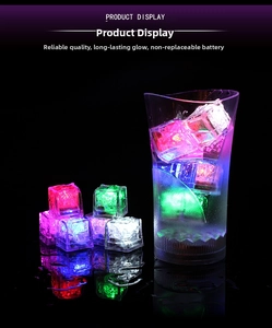 Close-up of colorful LED glowing ice cubes submerged in water with vivid light effects