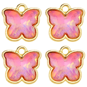 Detailed macro view of four butterfly charms with gold edges and pink crystal filling
